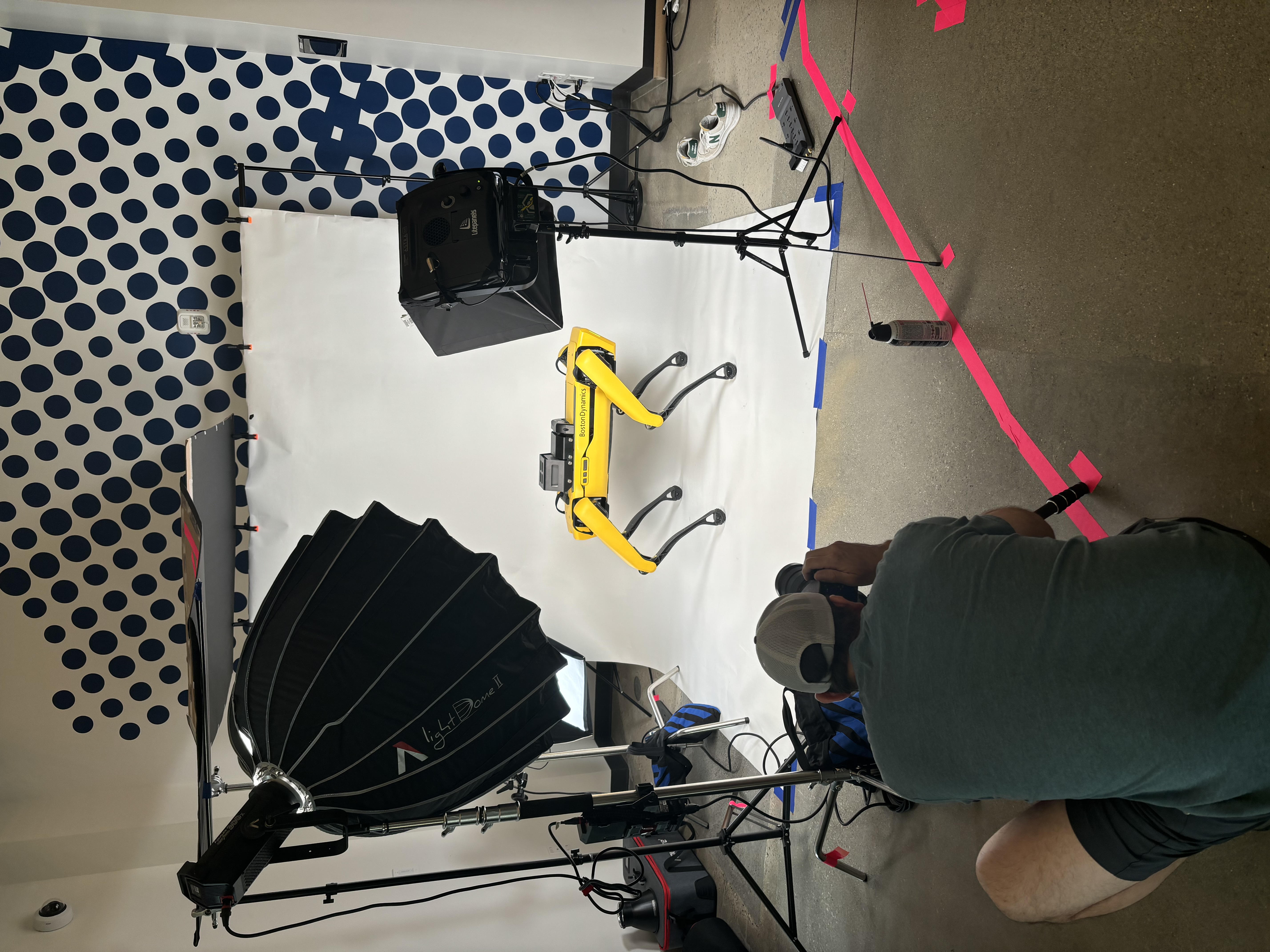 A professional photoshoot of a Boston Dynamics Spot robot.